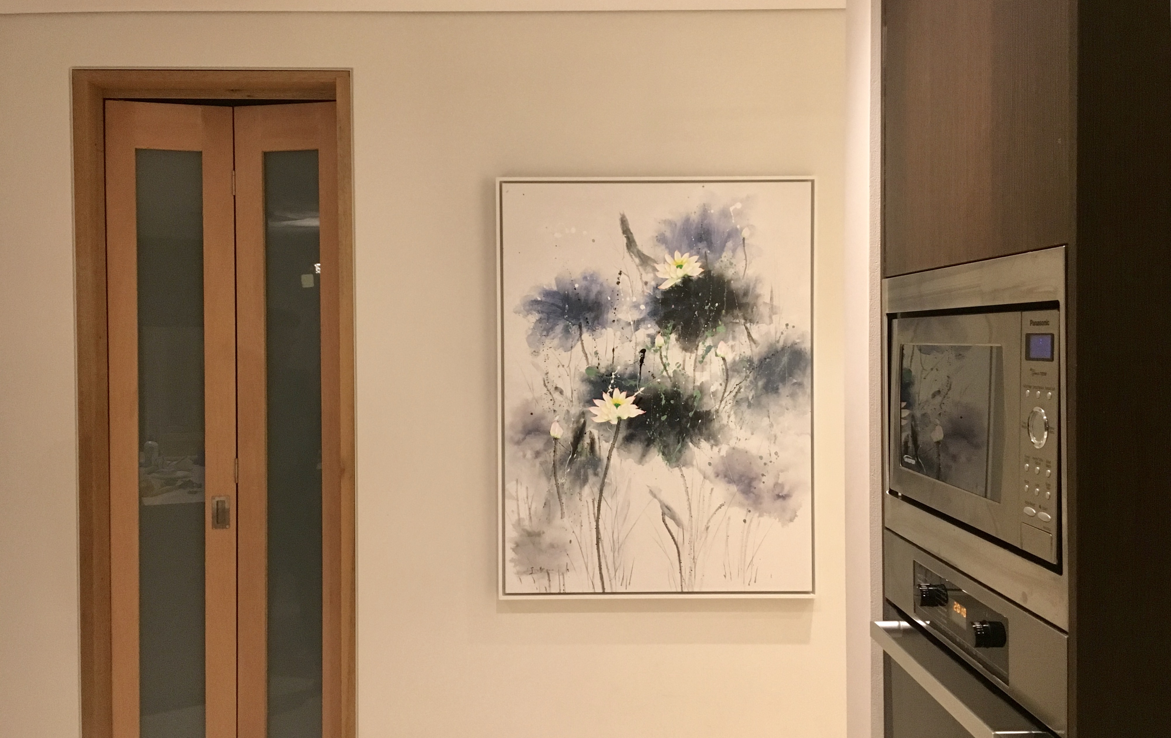 White float-framed canvas artwork displayed on a wall