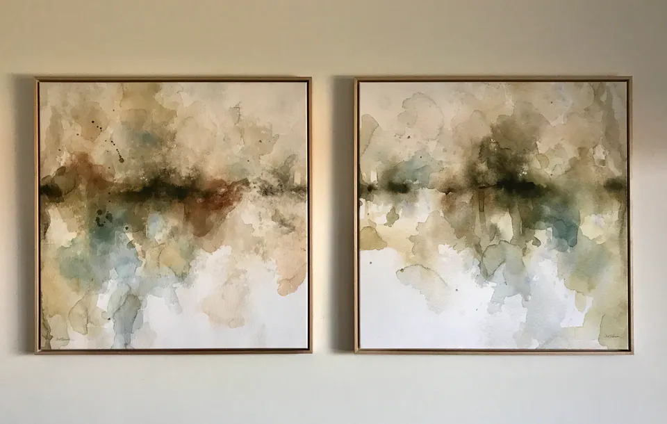 Two canvas prints finished in natural oak float frames