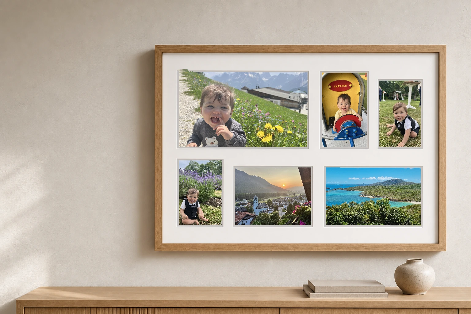 Natural oak custom collage frame displaying six baby, family, and travel photographs above a timber sideboard
