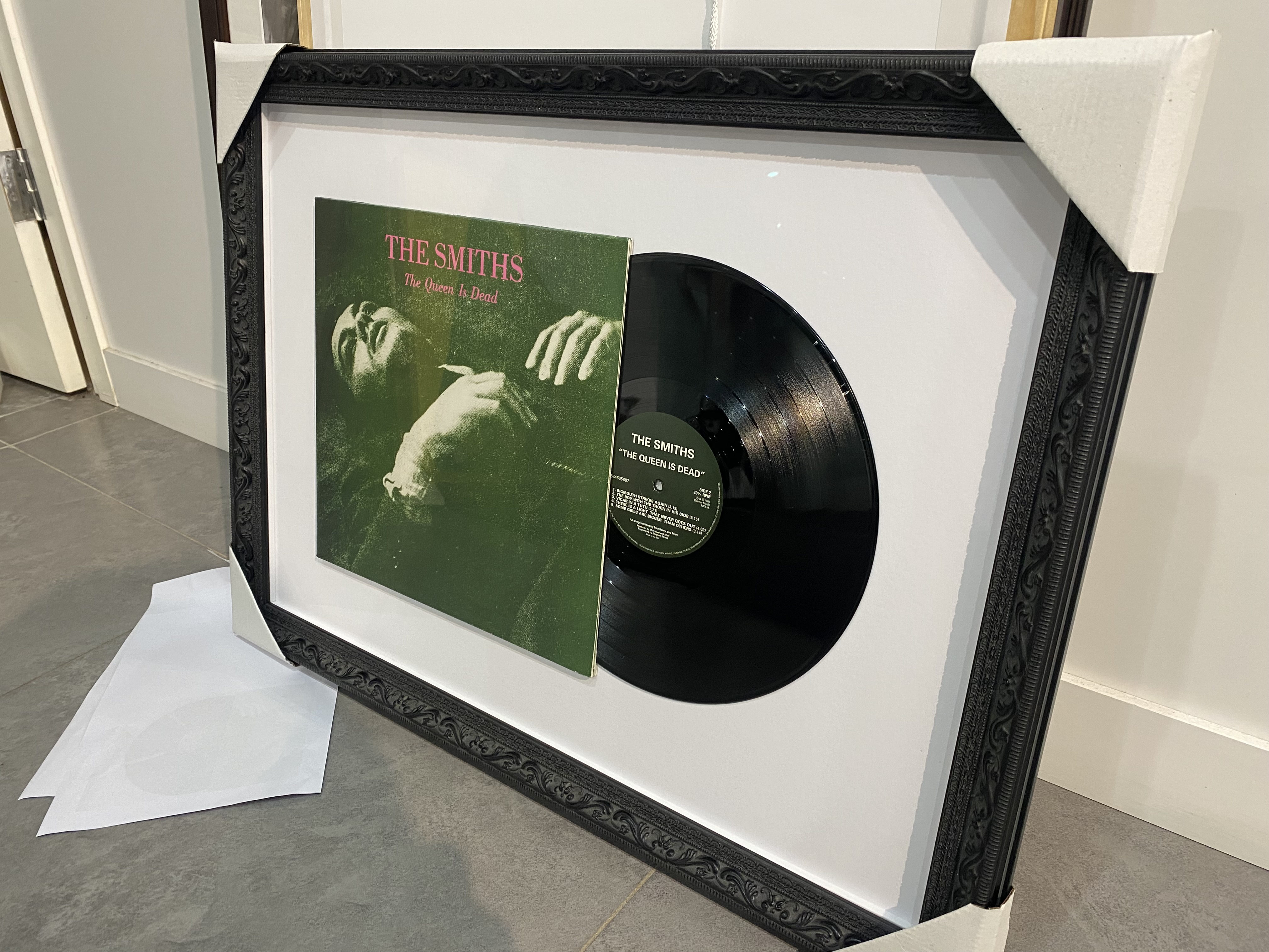 Vinyl record and sleeve framed in a double-mat layout